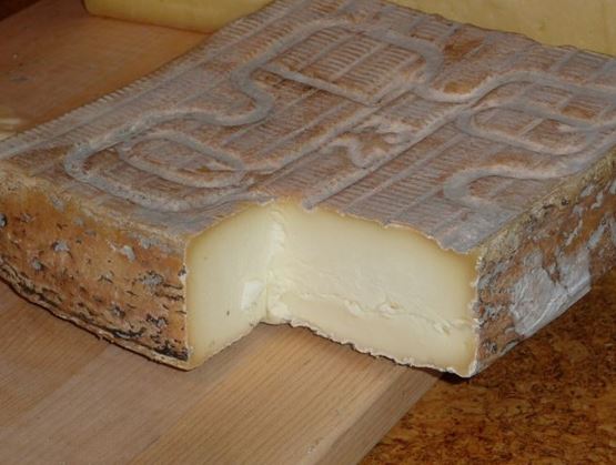 Taleggio cheese with washed rind and creamy pale paste.